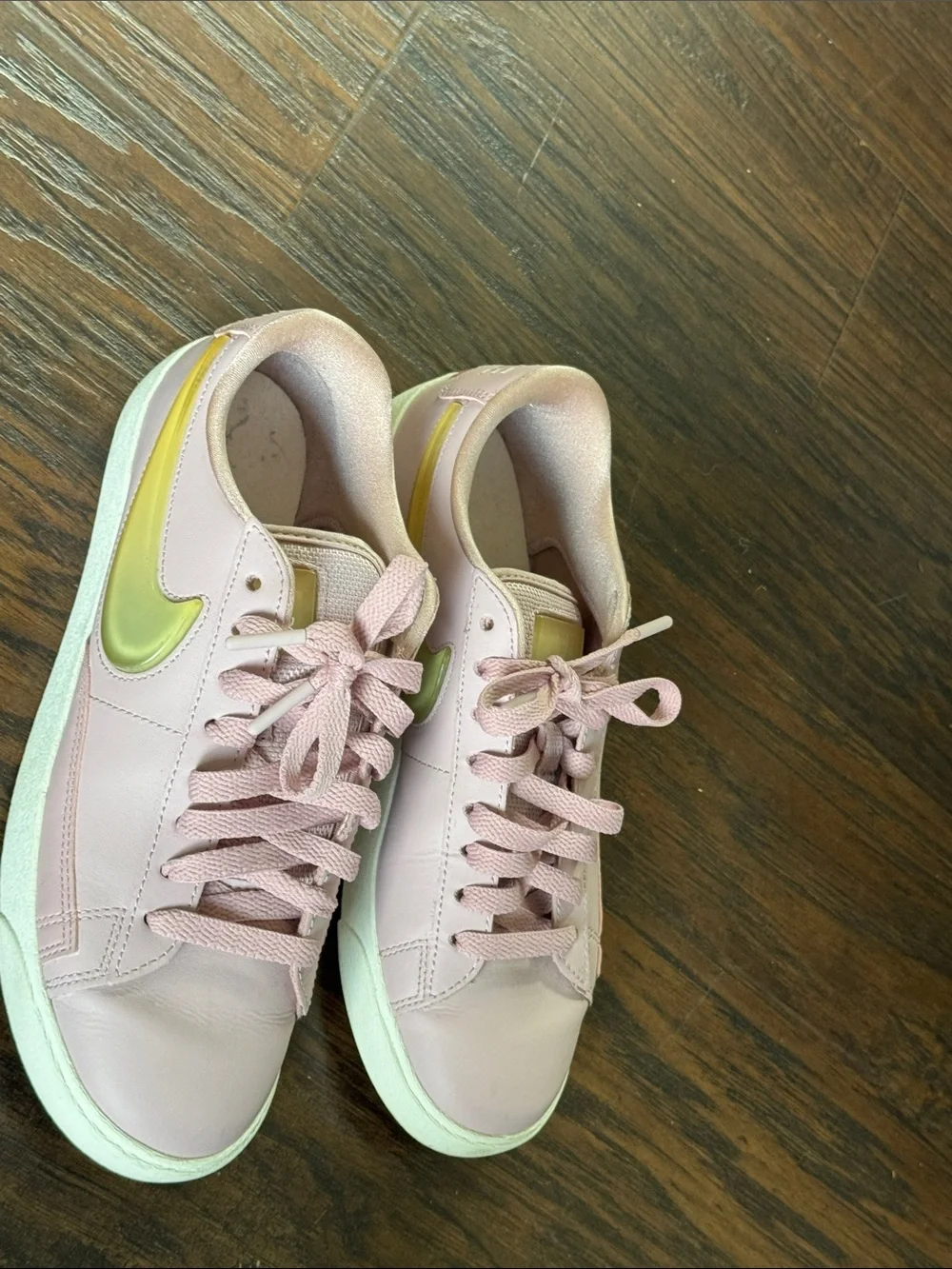 Nike Women's Blush Pink Low-Top Leather Sneakers with Metallic Gold Swoosh